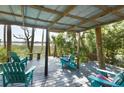 Relaxing outdoor seating area with scenic views of the trees at 4113 Buccaneer Rd, Isle of Palms, SC 29451