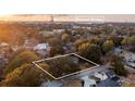 Aerial view of property highlighted by a white border, showcasing the surrounding neighborhood and proximity to the Ravenel Bridge at 434 Shannon Dr, Mount Pleasant, SC 29464