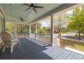 Inviting front porch with blue-painted ceiling, comfortable seating and neighborhood views at 545 Two Mile Run, Johns Island, SC 29455
