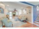 Spacious living room featuring hardwood floors, fireplace, and open floor plan design at 633 Schooner Rd, Charleston, SC 29412