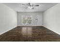 Bright, airy living room boasts hardwood floors and a modern ceiling fan at 874 Colony Drive # B19, Charleston, SC 29407