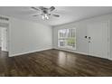 A view of the bright living room, showcasing hardwood floors and modern ceiling fan at 874 Colony Drive # B19, Charleston, SC 29407