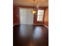 A lovely dining area with hardwood floors and bright natural light near a doorwall at 9028 Maple Grove Dr, Summerville, SC 29485
