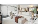 Inviting living room with hardwood floors, comfortable seating, and a seamless flow into the kitchen at 10 Logan St # 6, Charleston, SC 29401