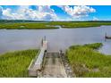 Private dock provides easy access to waterfront activities and stunning views at 110 Tidewater Way, Charleston, SC 29492