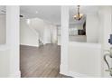 Open-concept living room with hardwood floors and staircase access at 112 Tin Can Aly, Summerville, SC 29483