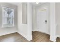 Bright living room featuring wood floors, white trim and ample natural light at 112 Tin Can Aly, Summerville, SC 29483