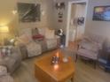 Inviting living room featuring comfortable seating, natural light, and seamless flow to the kitchen at 1273 Mathis Ferry Rd, Mount Pleasant, SC 29464