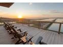 Relax with sunset views and drinks on this inviting deck complete with comfortable seating and marsh vistas at 1504 Forrest Ave, Folly Beach, SC 29439