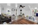 Spacious living room featuring hardwood floors, a ceiling fan, and ample natural light at 1617 Balsam St, Charleston, SC 29407