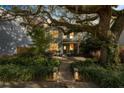 Charming two-story home with inviting brick pathway, lush landscaping, and mature tree at 2187 Annie Laura Ln, Mount Pleasant, SC 29466