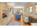 Formal dining room with hardwood floors, elegant furnishings, and ample natural light at 28 Rebellion Rd, Charleston, SC 29407