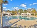 Large community pool featuring multiple white cabanas on a clear day at 2901 Backman St, Mount Pleasant, SC 29466