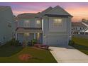 Inviting two-story home with a manicured lawn, captured at dusk for warm lighting at 2901 Backman St, Mount Pleasant, SC 29466