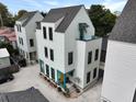 Three-story home featuring a gray roof and siding, as well as a rooftop patio area at 3 1/2 Maranda Holmes St # B, Charleston, SC 29403
