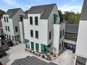 Three-story home featuring a gray roof and siding, plus a rooftop patio space at 3 1/2 Maranda Holmes St # B, Charleston, SC 29403