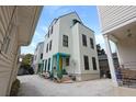 Three-story home featuring a gray roof and siding, plus a rooftop patio space at 3 1/2 Maranda Holmes St # B, Charleston, SC 29403