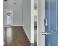 Welcoming home foyer featuring hardwood floors with glimpses of the living area and a glass-paneled backdoor at 304 Arbor Oaks Dr, Summerville, SC 29485