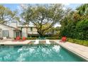 Backyard pool surrounded by mature trees and lounge chairs, offering a peaceful outdoor retreat at 3405 Cameron Blvd, Isle of Palms, SC 29451