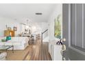 Open-concept living room and kitchen area with hardwood floors and bright, airy design at 3443 Yarmouth Dr, Mount Pleasant, SC 29466