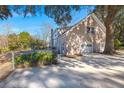 Rear view of property highlighting the two car garage and outdoor space at 4322 Bream Rd, North Charleston, SC 29418