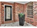 Covered entryway with brick accents, elegant door, and tasteful decor creates a warm welcome at 462 Mount Royall Dr, Mount Pleasant, SC 29464
