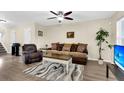 Cozy living room with comfortable seating, ceiling fan, and modern flooring at 601 Buckthorn Cir, Summerville, SC 29483