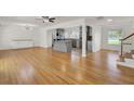 Open living area boasts hardwood floors and seamless flow into a modern kitchen at 703 Canary Dr, Charleston, SC 29414