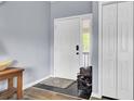 Entryway with coat closet, tile flooring, and a shoe rack for organization at 7940 Parklane Ct # F, North Charleston, SC 29418
