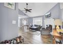 Bright living room featuring vaulted ceilings, hardwood floors, fireplace and an open floor plan at 7940 Parklane Ct # F, North Charleston, SC 29418