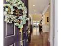 Welcoming entryway with wreath and view through to the bright living area at 113 Blackwater Way, Moncks Corner, SC 29461