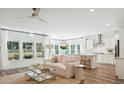 Bright living area with large windows, an open floorplan, and modern decor connecting to the kitchen at 1159 Darling St, Summerville, SC 29485