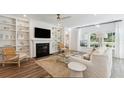 Inviting living room features a fireplace, built-in shelving, and lots of natural light at 1159 Darling St, Summerville, SC 29485