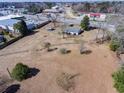 Aerial view of a single Gathering home and lot with mature trees and a large yard close to town at 126 N Hwy 52, Moncks Corner, SC 29461
