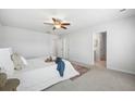 Serene bedroom with neutral tones, plush carpeting, ceiling fan, and plenty of closet space at 1309 Berry Grove Dr, Summerville, SC 29485