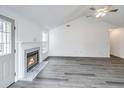 Cozy living room with a fireplace and stylish floors, perfect for relaxation at 1312 Belle Grove Cir, Hanahan, SC 29410