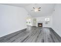 Bright living room featuring a fireplace, new floors and ample natural light at 1312 Belle Grove Cir, Hanahan, SC 29410