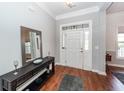 Welcoming foyer with hardwood floors, decorative mirror, and a stylish console table at 1433 Oakhurst Dr, Mount Pleasant, SC 29466