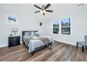 Comfortable bedroom with wood-look flooring, a ceiling fan, and great natural light at 1725 W Avalon Cir, Charleston, SC 29407