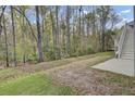A spacious backyard bordered by a lush forest offers privacy and tranquility at 1821 Mead Ln, Johns Island, SC 29455