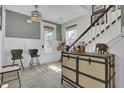 Inviting entryway featuring stylish decor, a trunk-style cabinet, and stairway access at 1821 Mead Ln, Johns Island, SC 29455