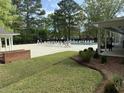 Relaxing community pool area with plenty of seating for residents to enjoy the sunshine and poolside leisure at 317 Commons Way, Goose Creek, SC 29445
