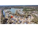Scenic aerial view of a neighborhood with homes surrounding a beautiful lake and lush greenery at 3199 Great Egret Dr, Johns Island, SC 29455