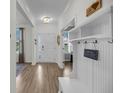 Inviting entryway featuring beautiful floors, a coat rack, and a view into other rooms at 3199 Great Egret Dr, Johns Island, SC 29455