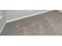 Neutral bedroom featuring tan carpet and a white baseboard at 3529 Galaxy Rd, Ladson, SC 29456