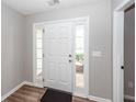 Bright entryway featuring a white front door with sidelights and neutral-toned walls at 3529 Galaxy Rd, Ladson, SC 29456