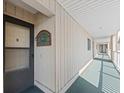 Exterior hallway leading to residences, covered from the elements, and featuring outdoor carpeting at 3701 Docksite Rd # 108, Edisto Beach, SC 29438