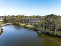 Stunning aerial view of property showcasing waterfront access and lush landscaping at 4364 Sea Forest Dr, Kiawah Island, SC 29455