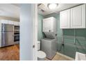 Convenient laundry room with stacked washer and dryer next to kitchen at 507 Stinson Dr # 3A, Charleston, SC 29407