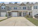 Attractive townhomes with well-maintained lawns and driveways, providing curb appeal and convenient parking at 637 Hilchot Dr, Summerville, SC 29486